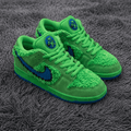Green sneakers with blue accents on a gray textured surface