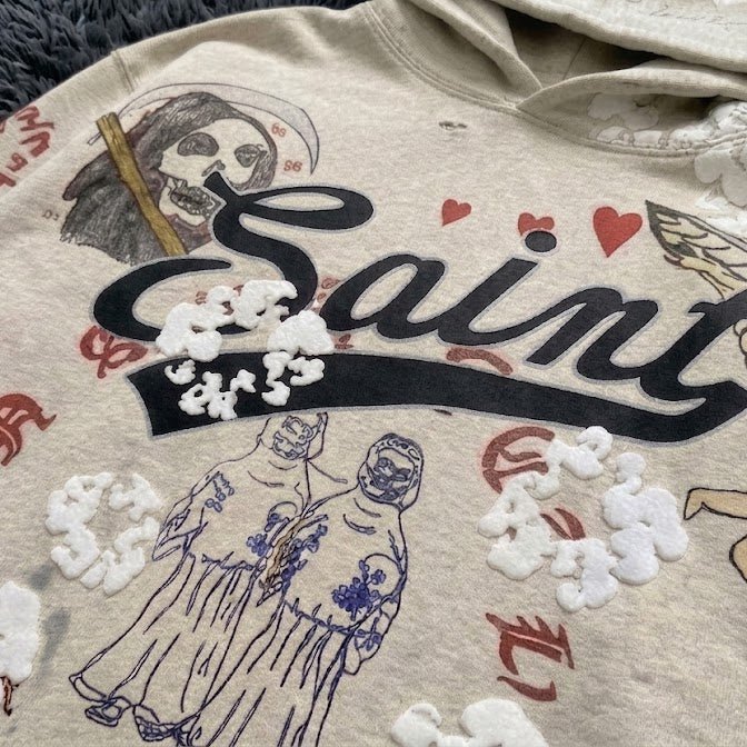 SAINT MxxxWxxx Graffiti Collage Hoodie - Distressed Saint/Reaper Graphic