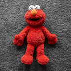KAWS x Uniqlo Sesame Street Plush Toy