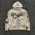 SAINT MxxxWxxx Graffiti Collage Hoodie - Distressed Saint/Reaper Graphic